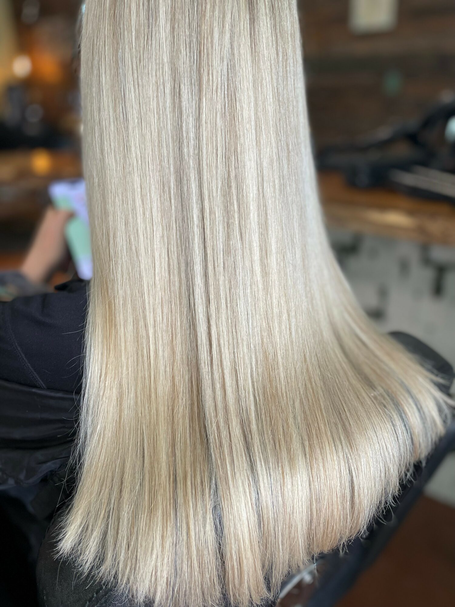 Long, straight, blonde hair with a smooth texture and shiny appearance.
