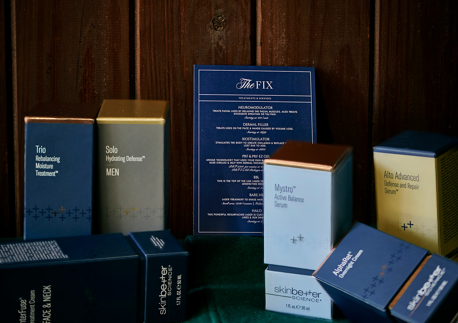 Display of skincare and men's grooming products with a blue menu or informational sheet in the background.