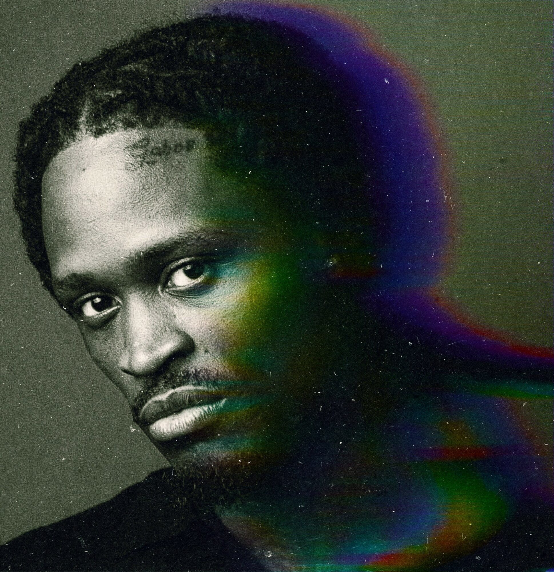 Portrait of a young man with braided hair, looking directly at the camera, with a colorful rainbow-like overlay on the right side.
