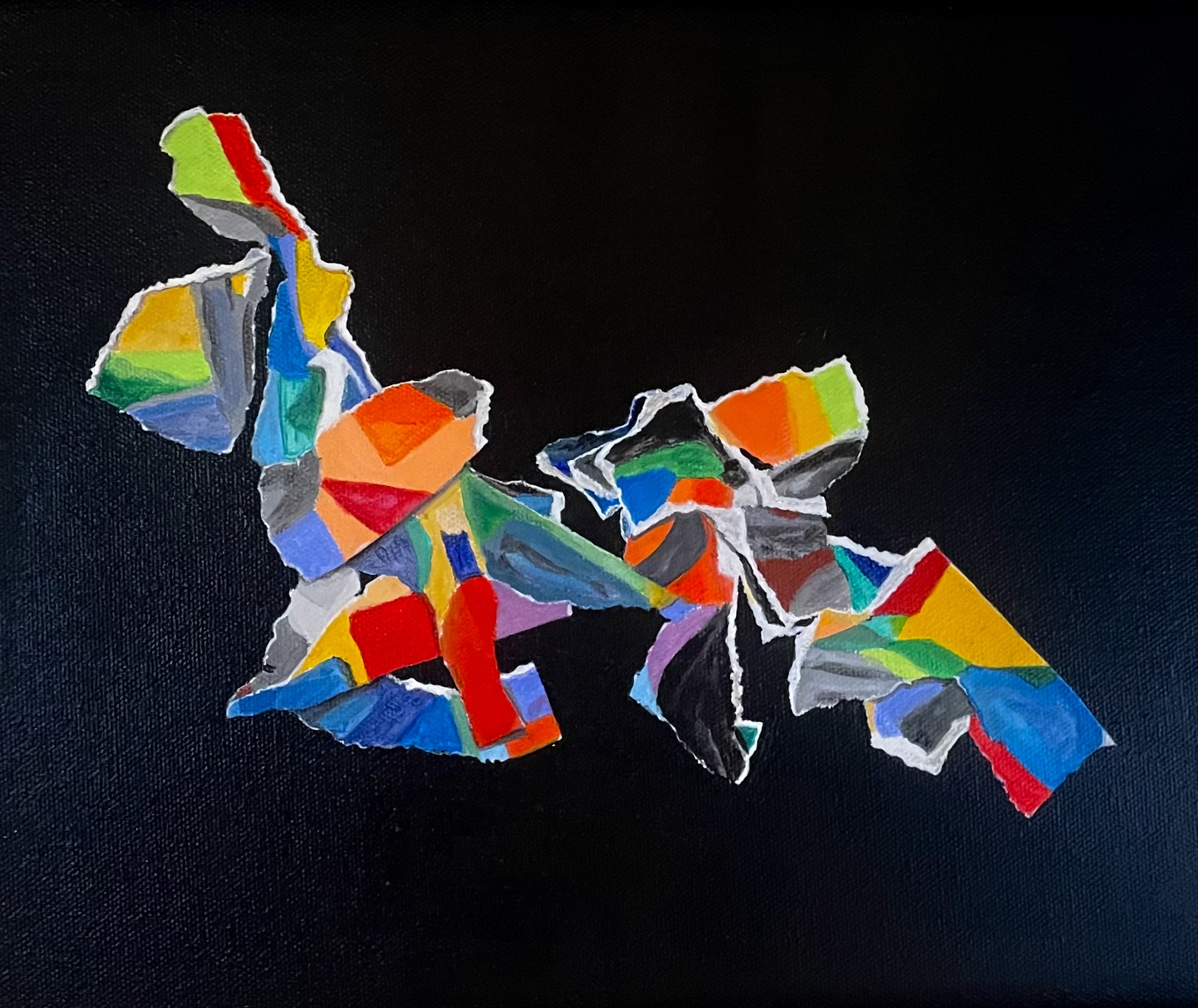 Colorful torn paper pieces arranged on a black background, forming an abstract shape.