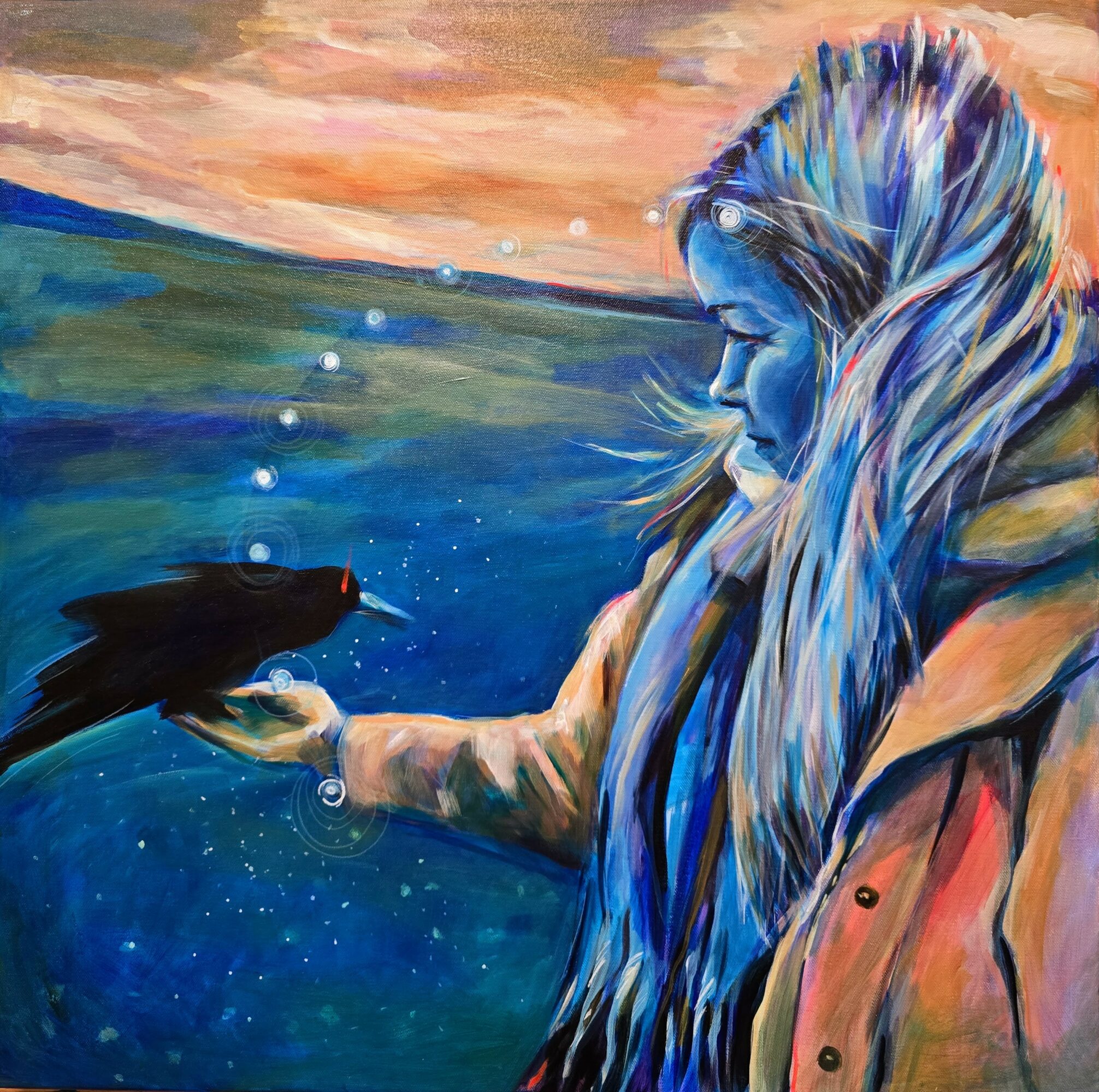 A girl with long, colorful hair holds a black bird over water, with a sunset sky in the background.