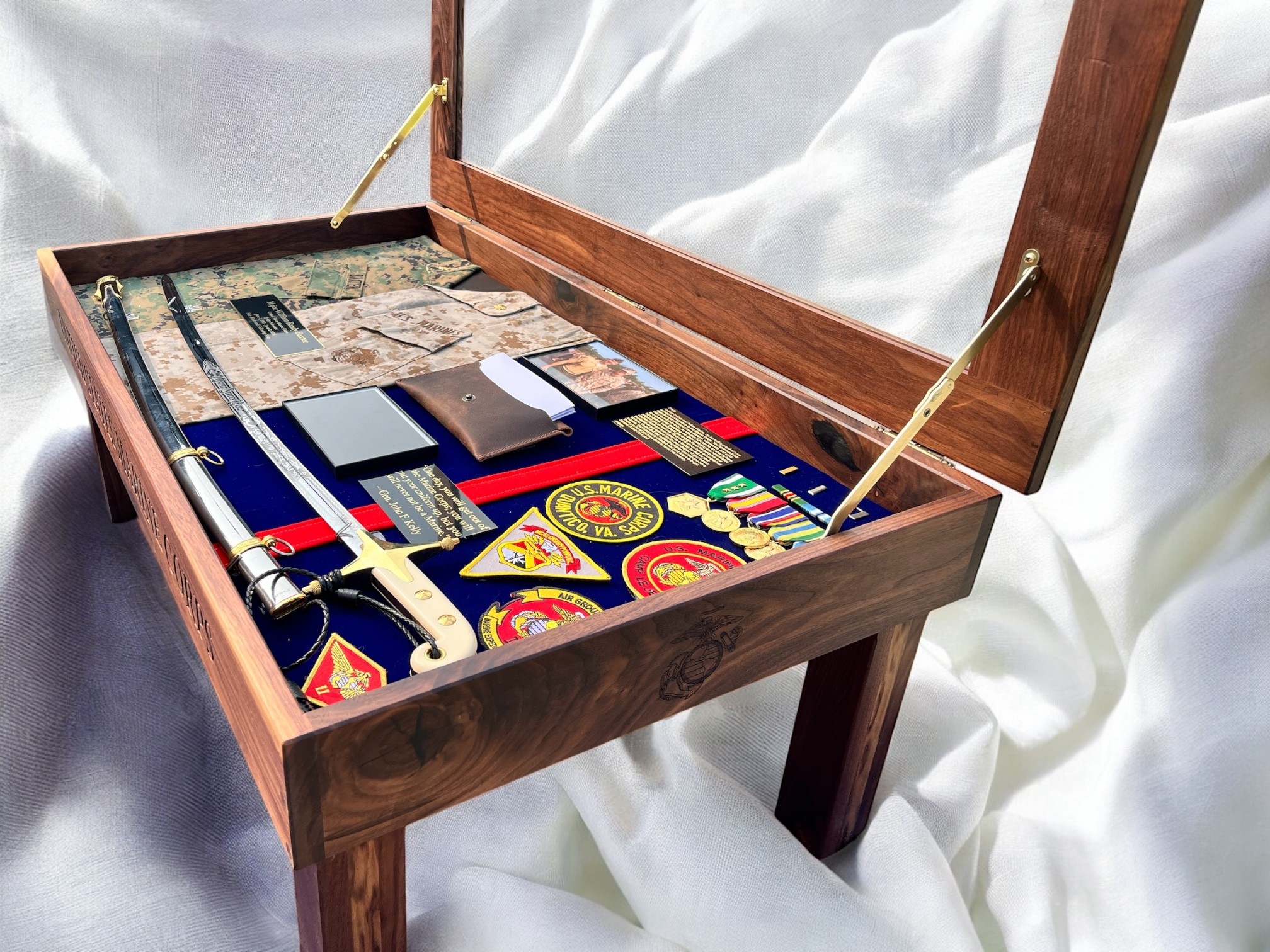 Open wooden box with a velvet-lined interior containing playing cards and poker chips.