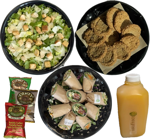 Salad, breaded chicken pieces, spring rolls, salad dressing, and soup on a black background.
