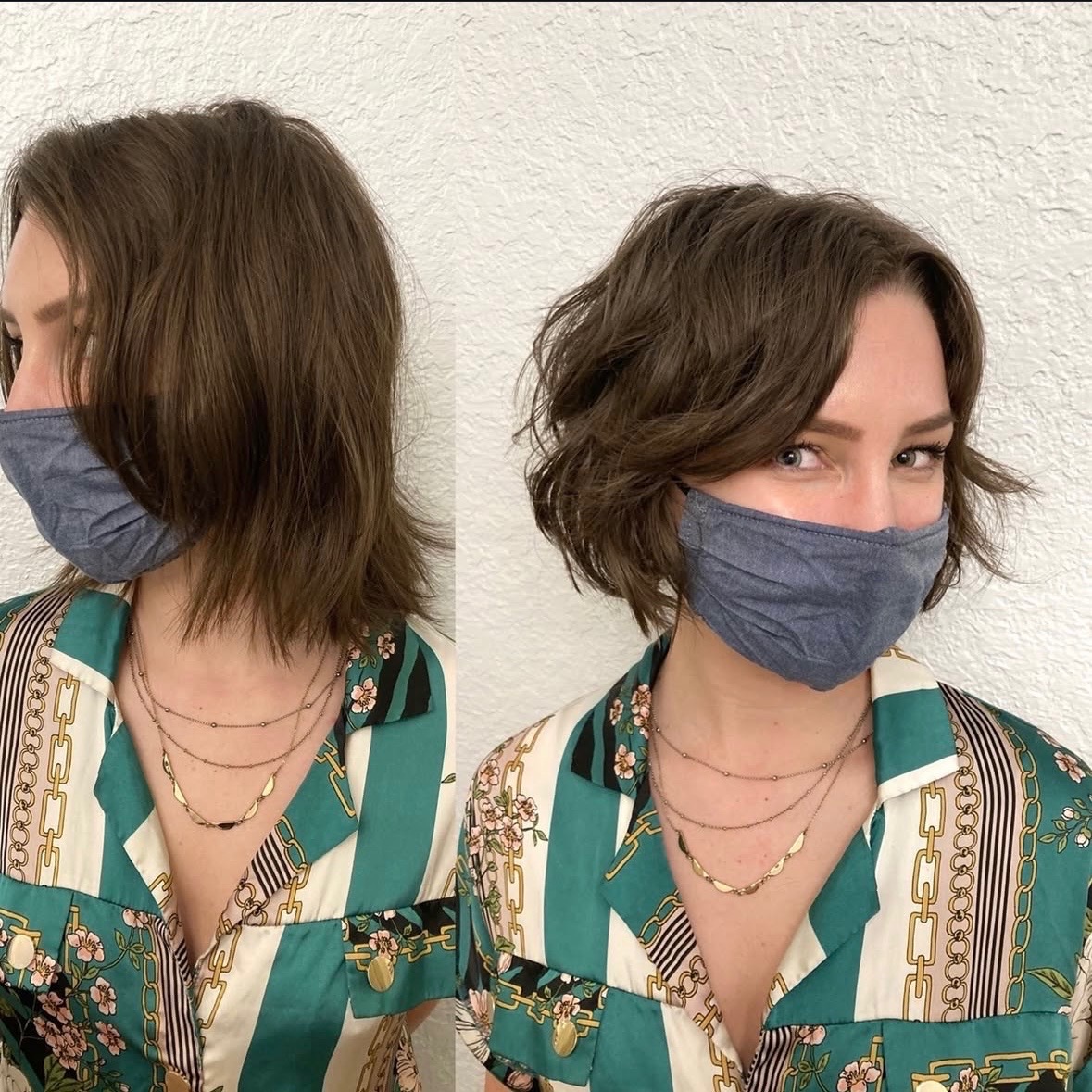 Woman with short wavy hair wearing a face mask and patterned shirt, looking at the camera.