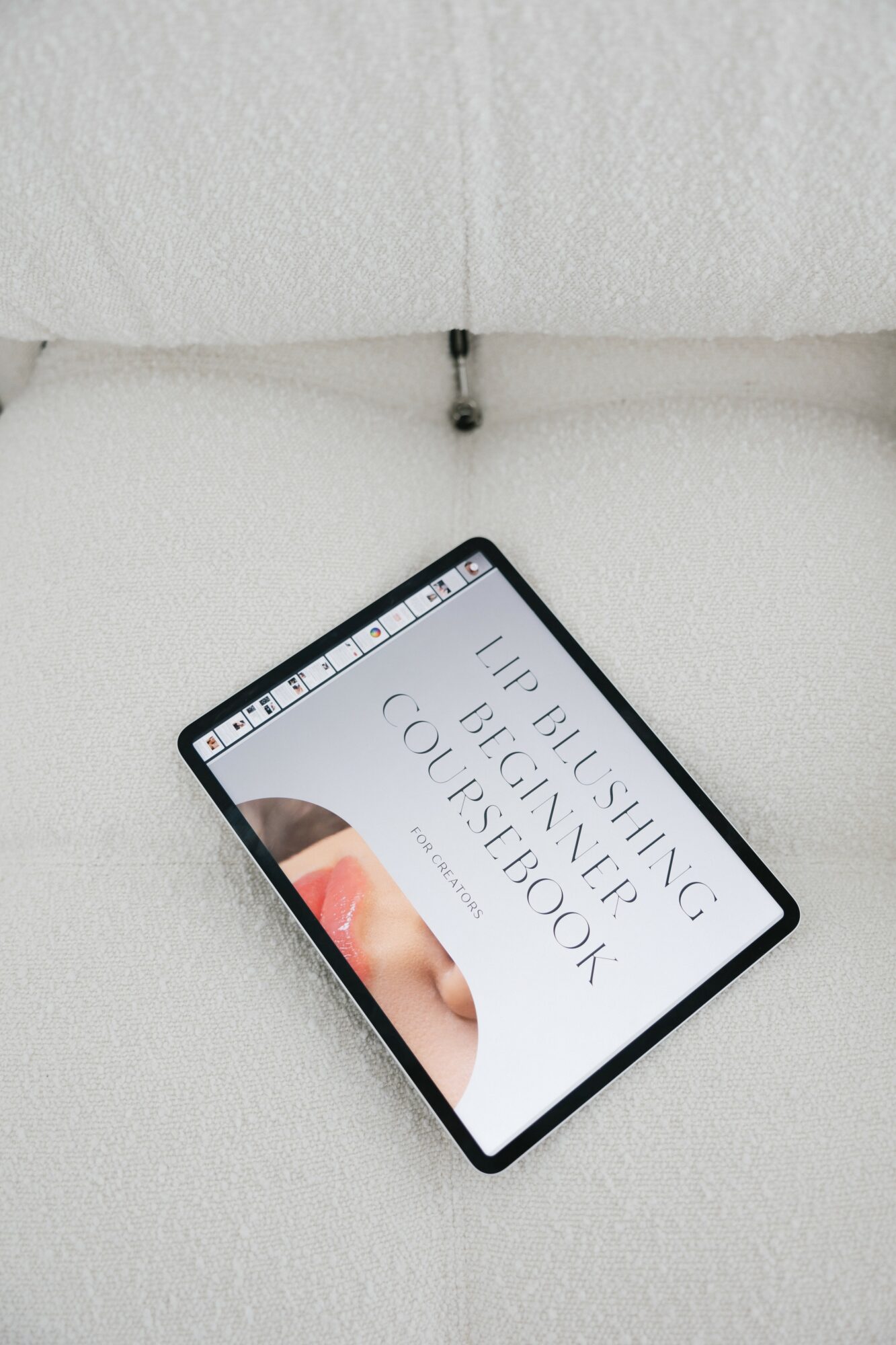 Smartphone displaying a book cover titled 'Hip Hopping Big Cock Coloring Book' on a white surface.