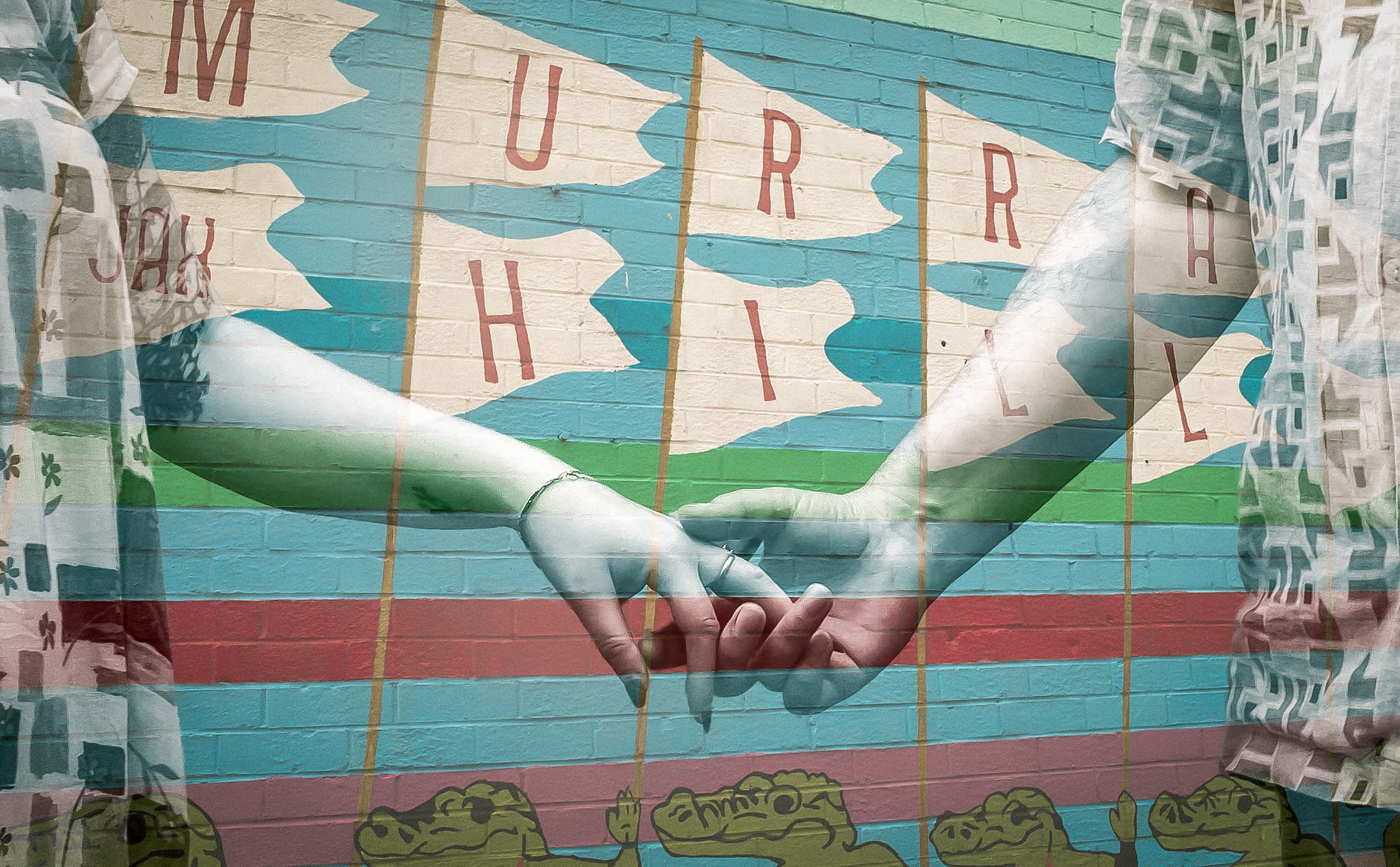 Two hands holding each other through a window with curtains, with a colorful background and letters on paper flags.