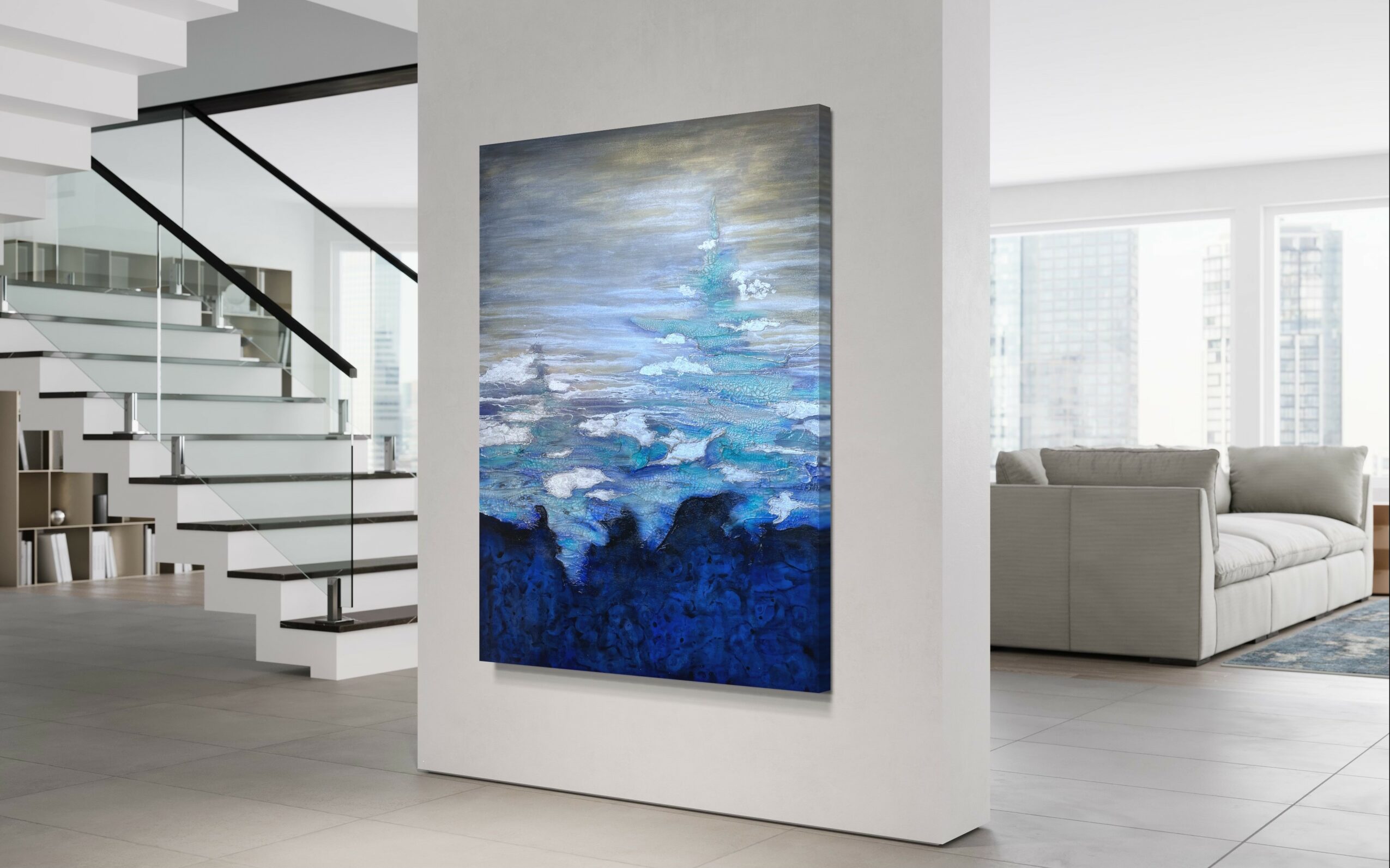 Abstract blue and white painting on a white wall in a modern, open-concept living space with stairs and large windows.