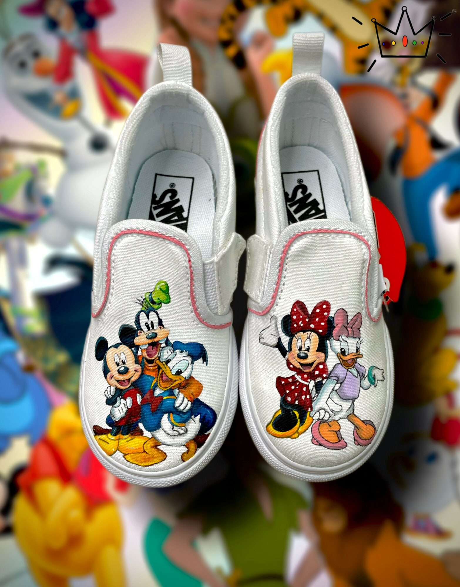 Pair of white children's shoes with Disney character illustrations, featuring Mickey Mouse and Minnie Mouse, on a colorful background.