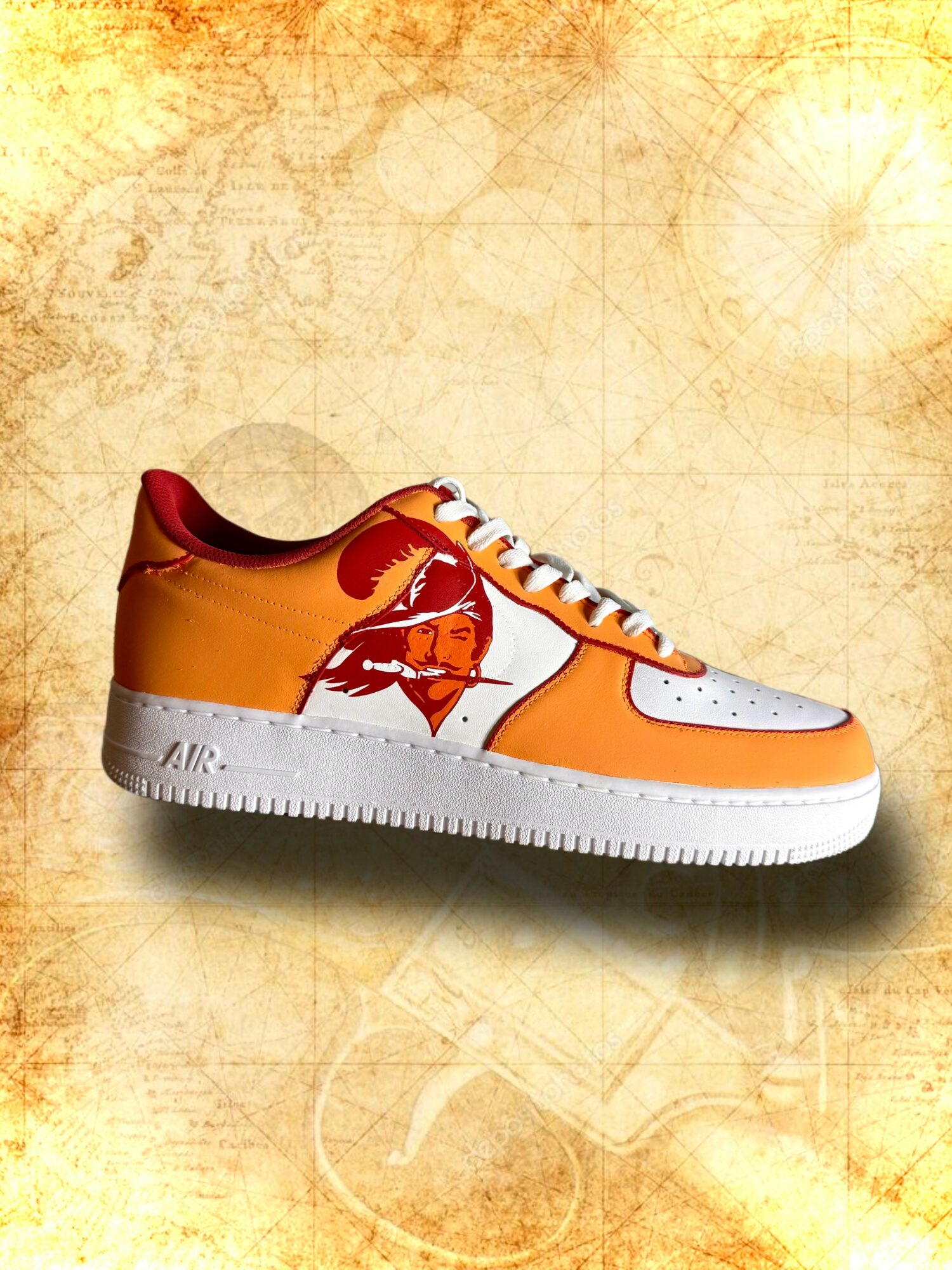 Orange and white sneaker with a red and yellow graphic on the side, set against a textured yellow background.